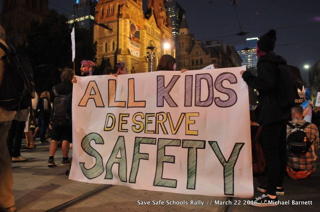 Banner says 'all kids deserve safety'