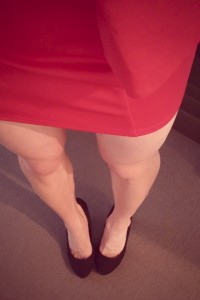 Legs showing in red miniskirt