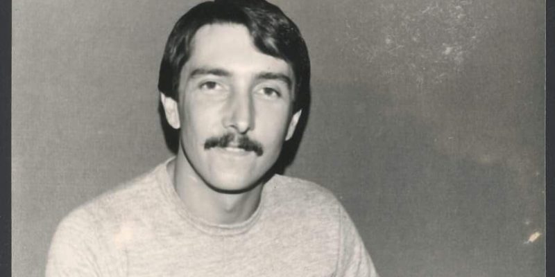 a black and white photo of McGahen, who has brown hair and a moustache