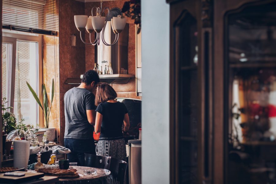 Couple cooking together in a kitchen