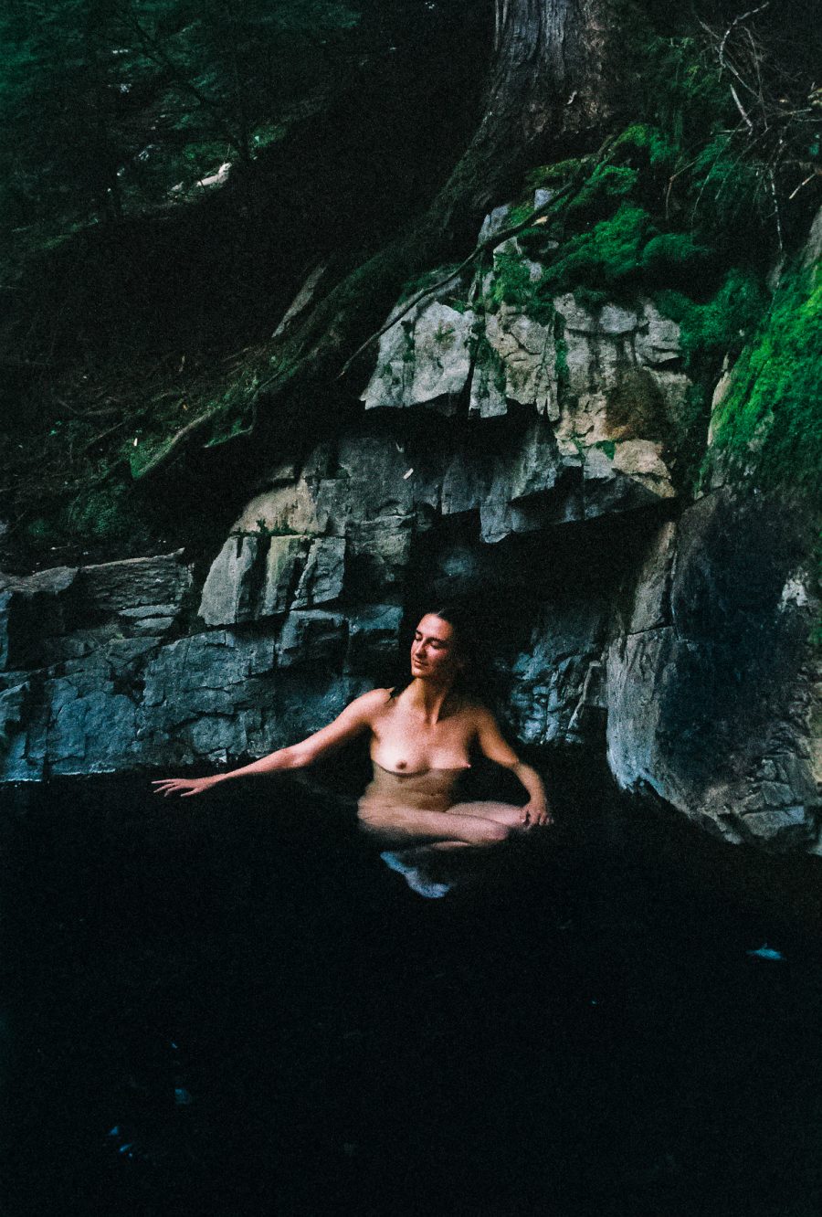 A person bathing in a hot spring.