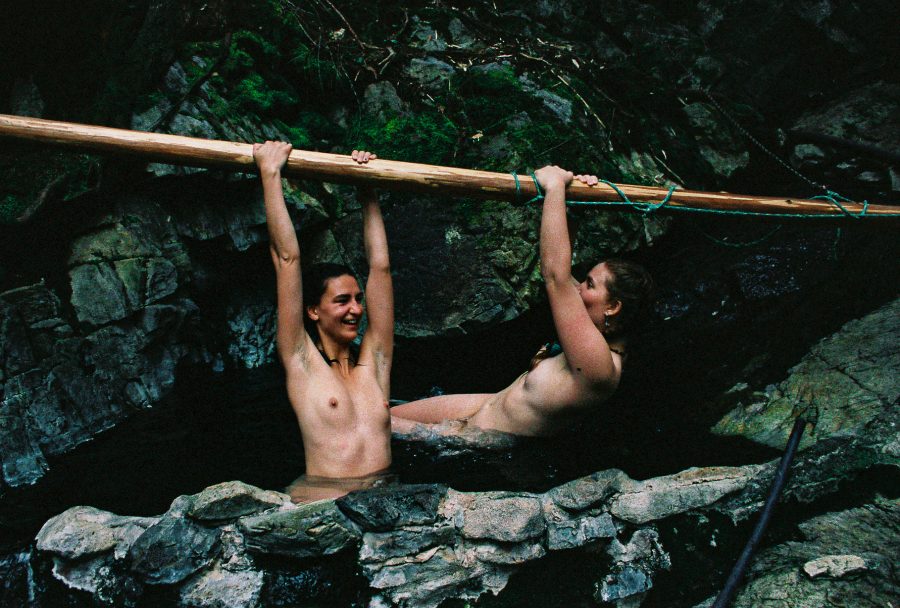 Two people playing in a hot spring.