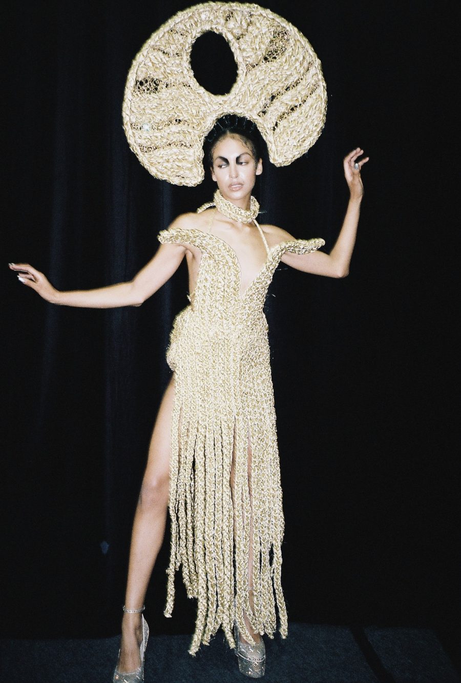 A person wearing one of Nathaniel's braided designs with a headpiece.