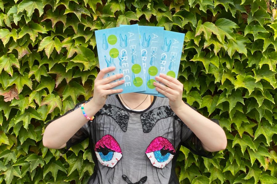 Alex Creece holding up three copies of her new book, 'Potty Mouth, Potty Mouth'.