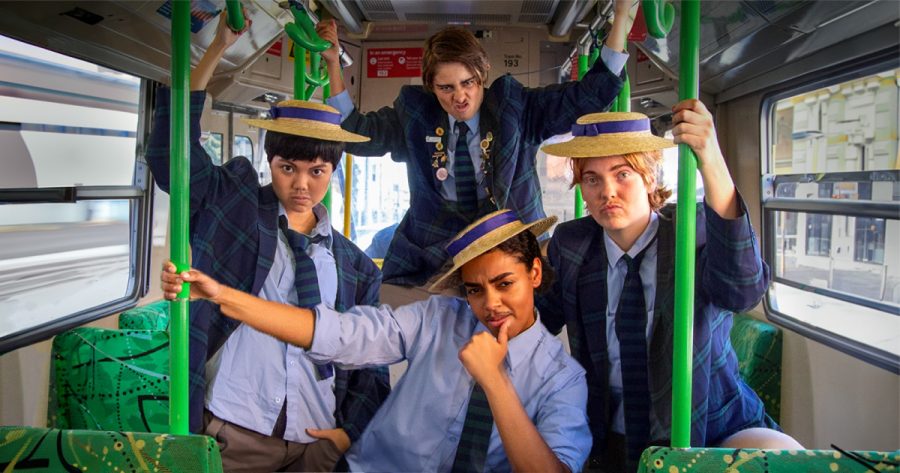 The cast of Trophy Boys posing on a tram.