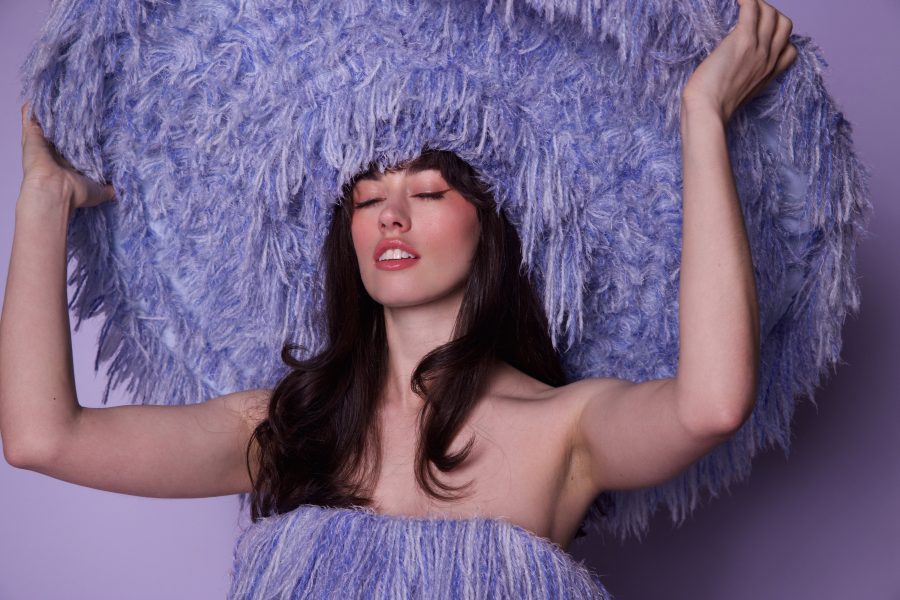 Magnets in a woolen purple fascinator.