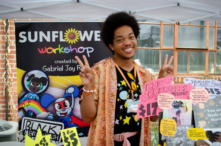 Gabriel Joy Reid in front of her art stall at the Queer/Trans Zine Fest.