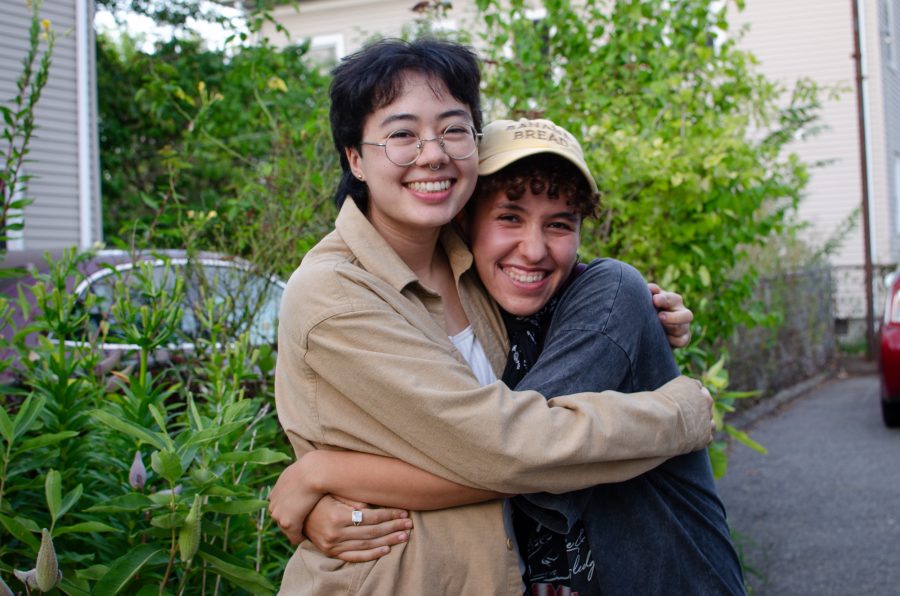 Jules Kang Sharpe and Madison Tom hugging at the Queer/Trans Zine Fest.