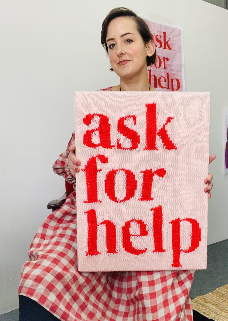 Kate Just with a textile saying "ASK FOR HELP".