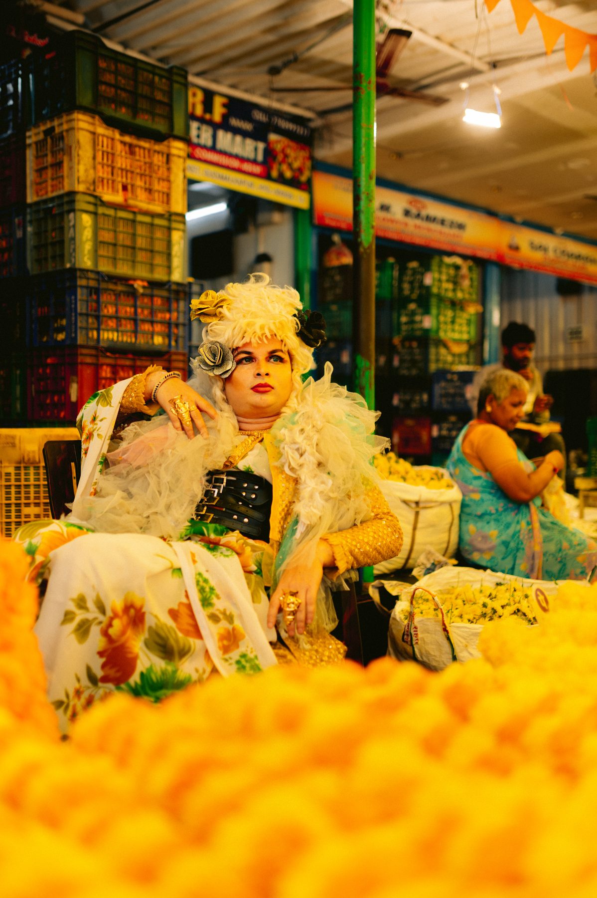 Patruni poses among flowers.
