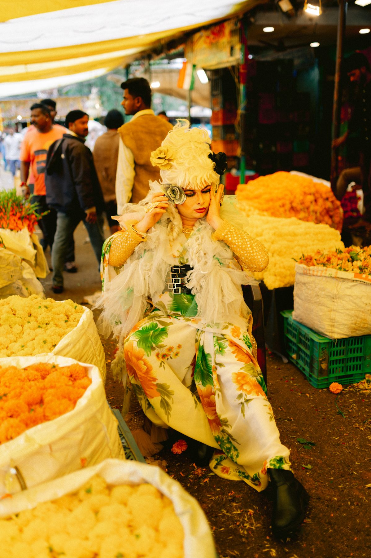 Patruni in the aisle of the flower market.
