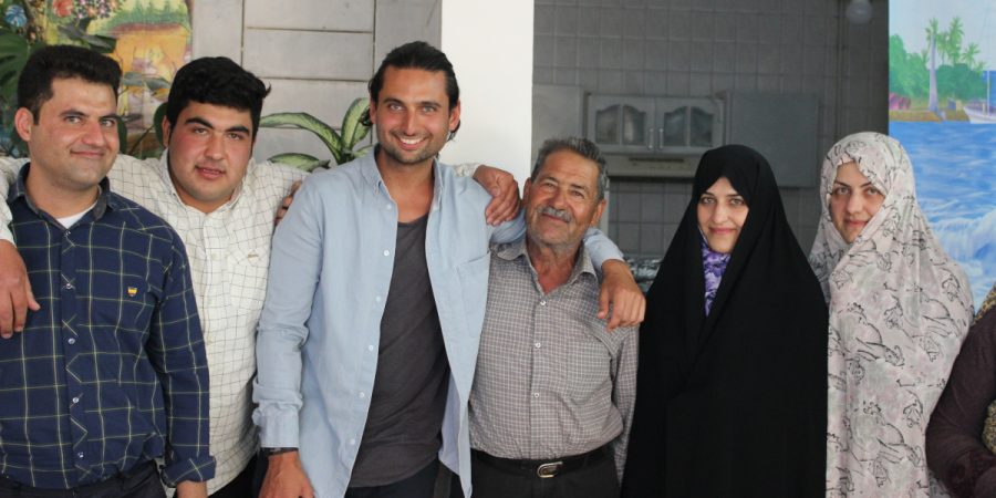 An Iranian family with Adam, a second-generation immigrant to Australia, in the centre.