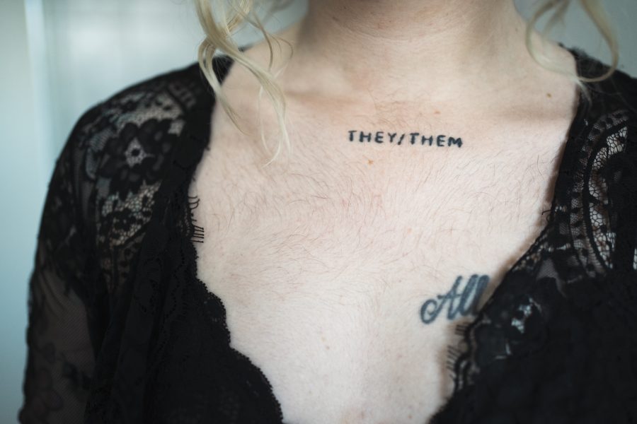 Neck tattooed with "THEY/THEM". Image by Danielle Fitzgerald.
